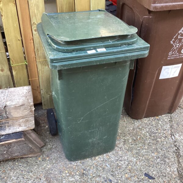 Green wheelie bin for garden waste or recycling.