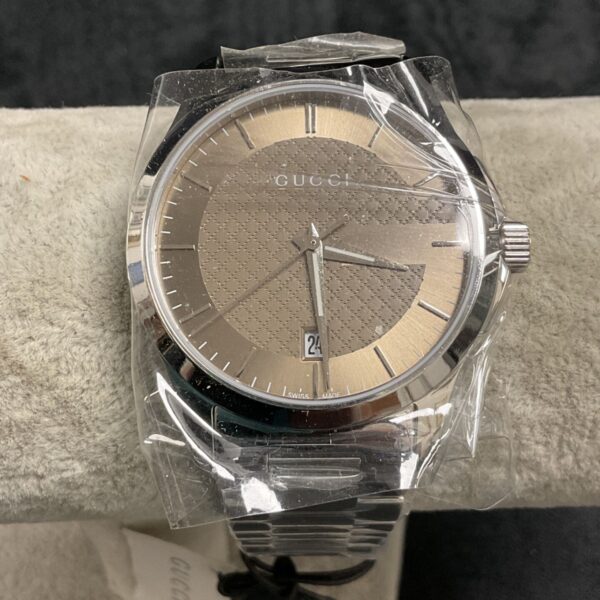 Close-up of the Gucci reproduction watch dial and stainless steel bracelet.