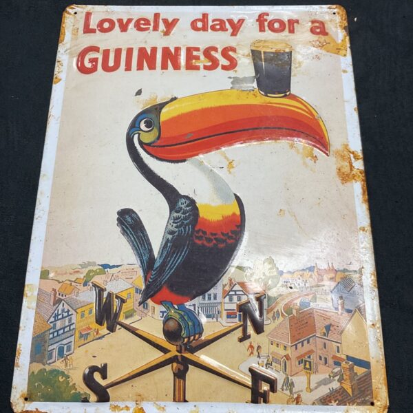 Vintage Guinness advertising sign featuring a toucan.
