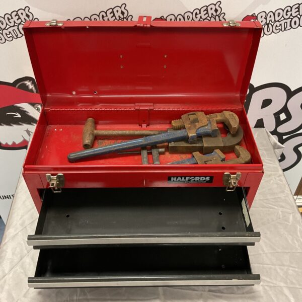 Red Halfords Professional metal tool box open with pipe wrenches inside