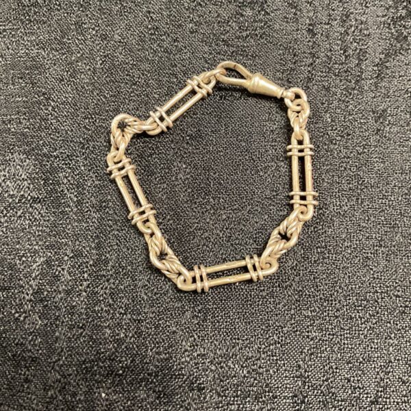 Hallmarked sterling silver staple link bracelet with twisted connectors and dog clip