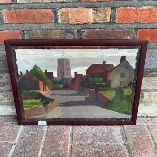 Framed 1952 oil painting by Harold Hussey of a village street and church tower