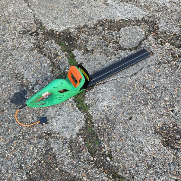 Hawksmoor electric hedge trimmer for garden maintenance.