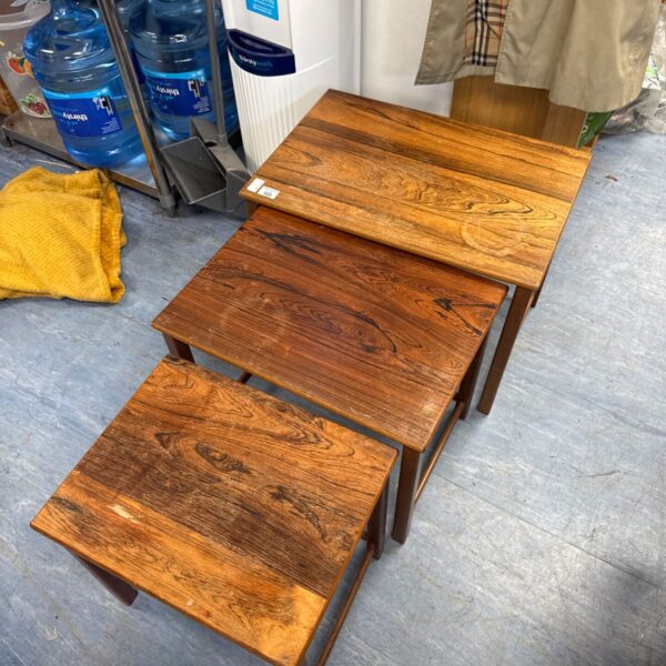 Heal's nest of three graduated wooden tables with figured timber tops