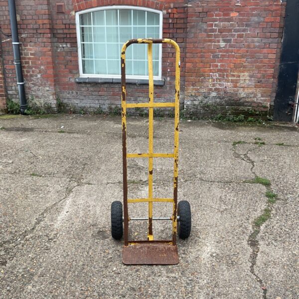 Vintage heavy-duty sack truck for lifting and moving loads.
