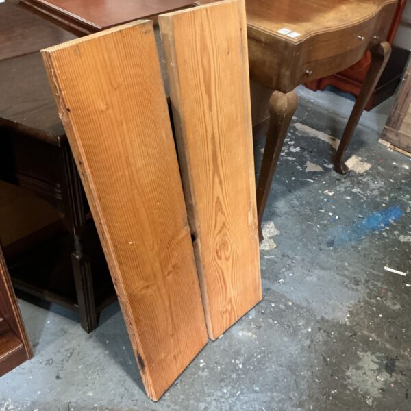 Pair of heavy duty wooden shelves with visible timber grain and squared edges