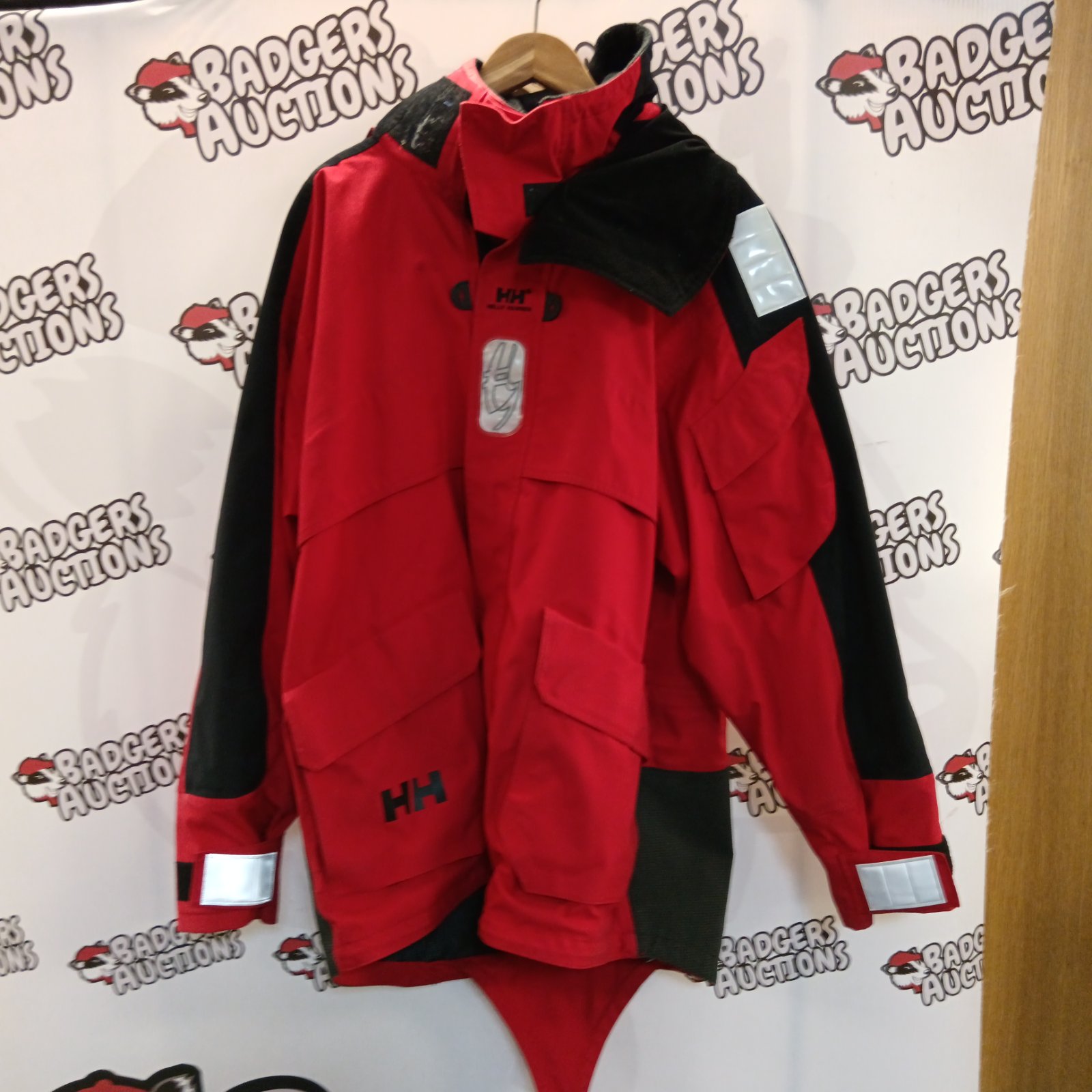 Red Helly Hansen sailing jacket, size large, outdoor waterproof gear.