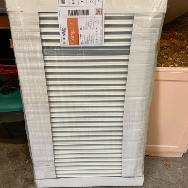 White Henrad compact 700x1200 radiator for central heating.