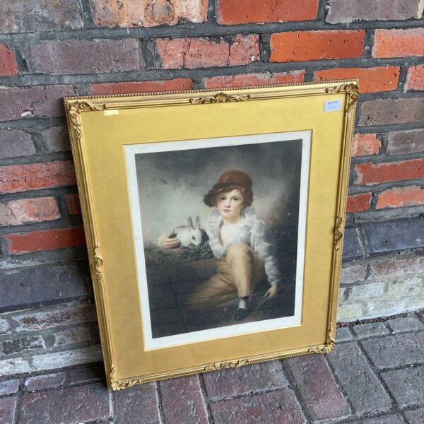 Framed Henry Raeburn mezzotint of a boy with a white rabbit in gilt frame