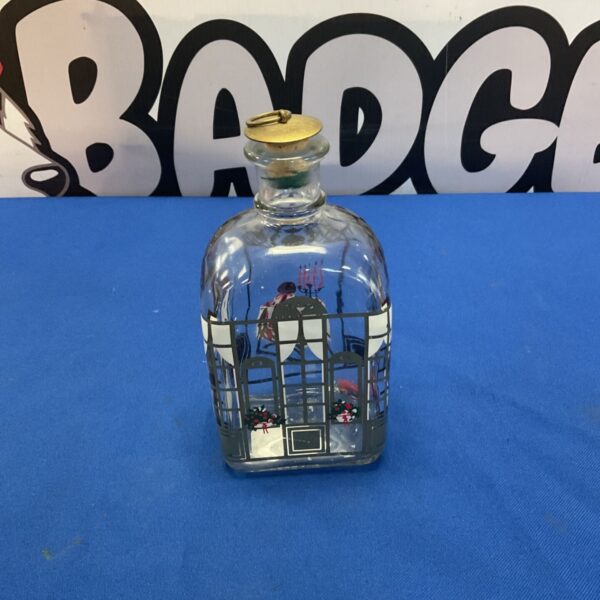 Holmegaard Christmas bottle with festive winter scene design.