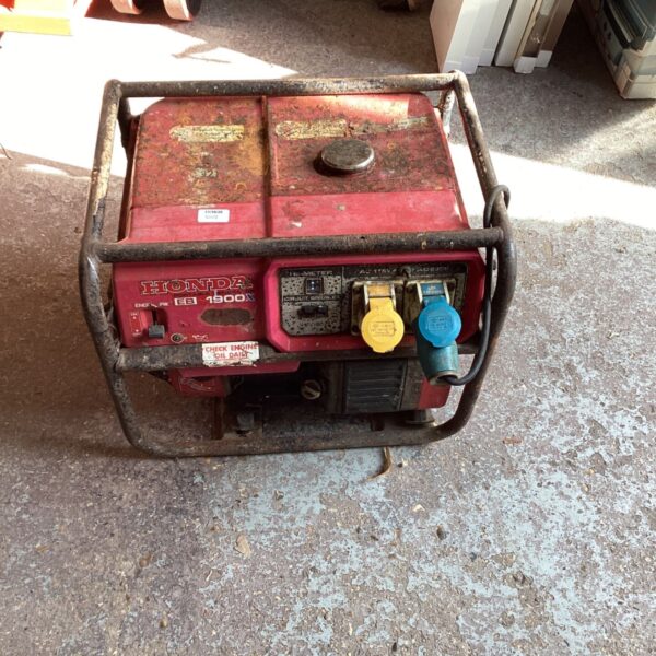 Red Honda portable generator showing signs of wear and corrosion.