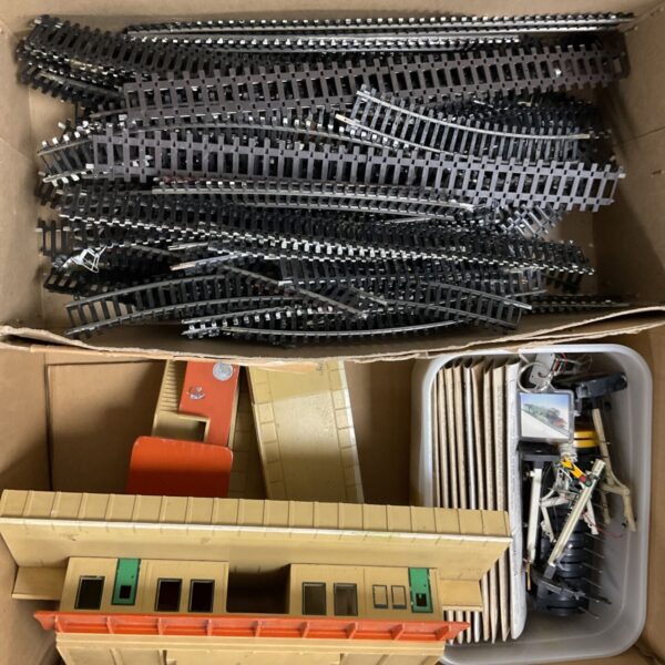 Hornby OO gauge railway track lot with station and signals.