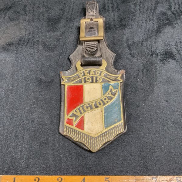 Vintage enamel horse brass commemorating Peace 1919 and Victory.
