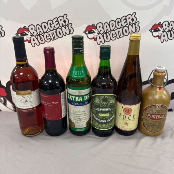 House clearance alcohol lot featuring wine, vermouth, and hock bottles.