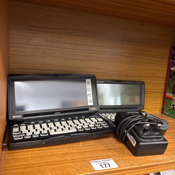HP 620LX Palmtop PC with charger, vintage handheld computer.