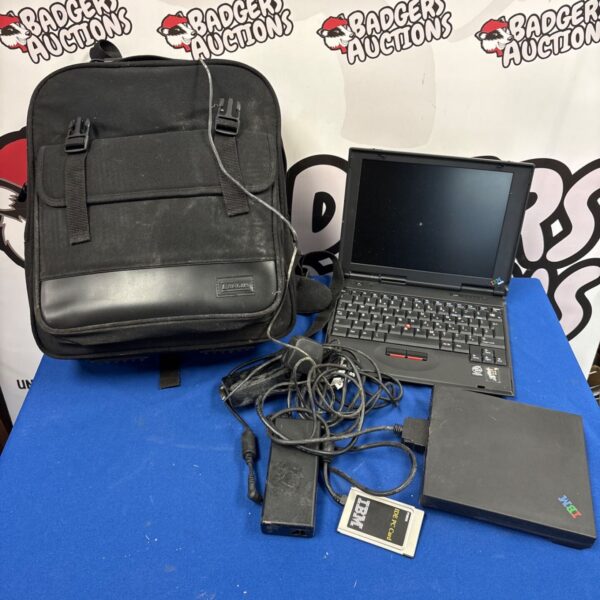 IBM ThinkPad 240 laptop with drive bay, carrying bag and power adaptor