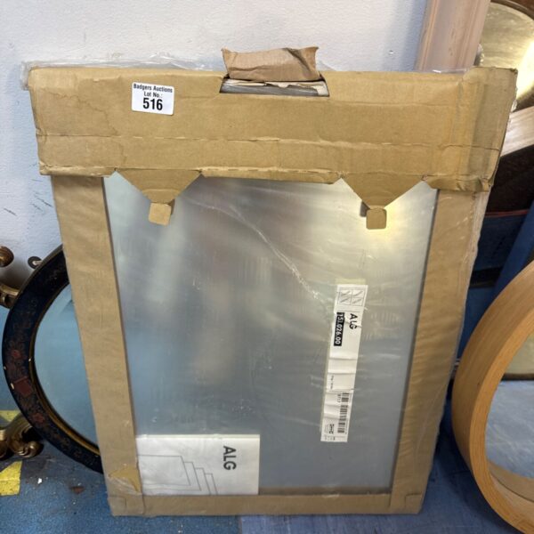 New Ikea Alg mirror in original packaging, ready for mounting.