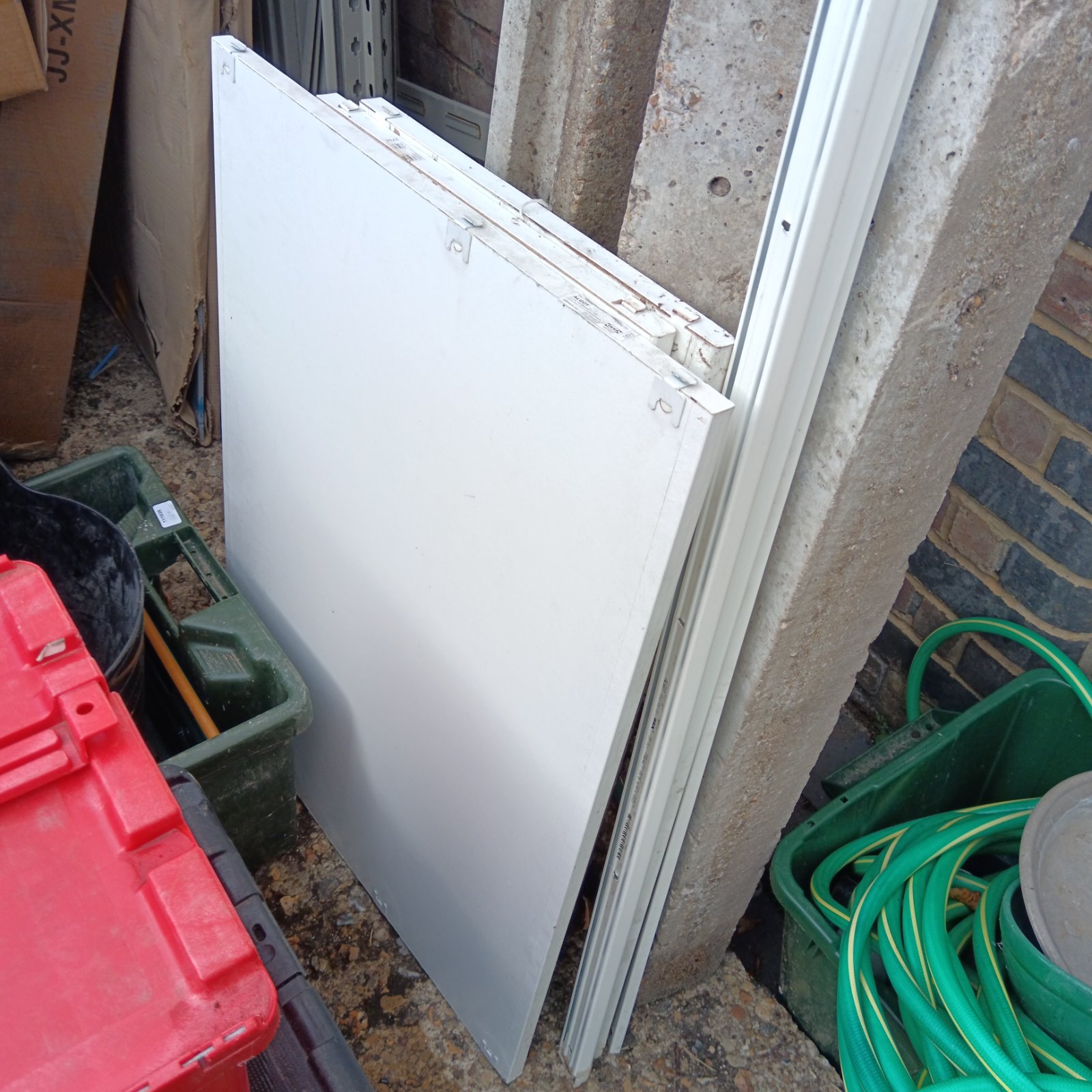 White IKEA Algot shelving panel for modular storage.