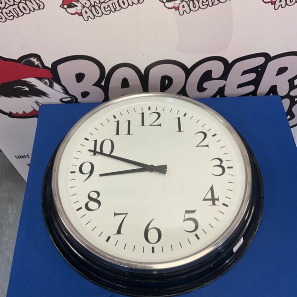 Large Ikea wall clock with a white face and black hands.