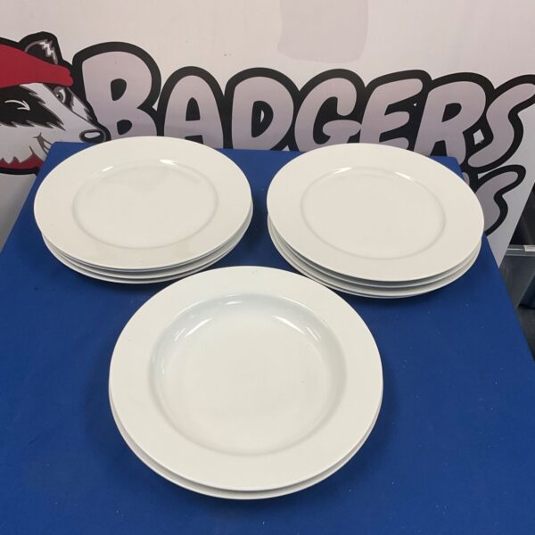 White IKEA plates and bowls set on a table.