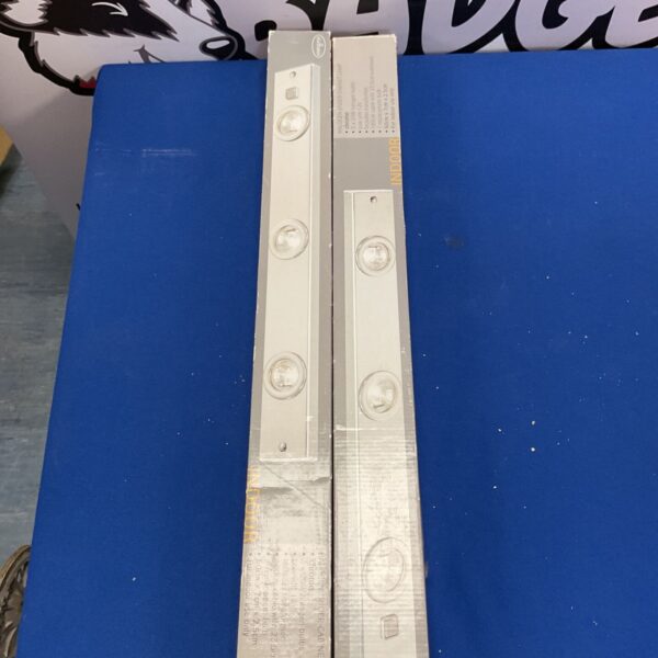 Illumination halogen under cabinet lamp in original packaging.