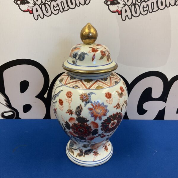 Antique Chinese Imari ginger jar with floral design.