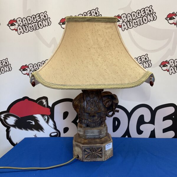 Detailed resin Indian elephant table lamp with a beaded lampshade.