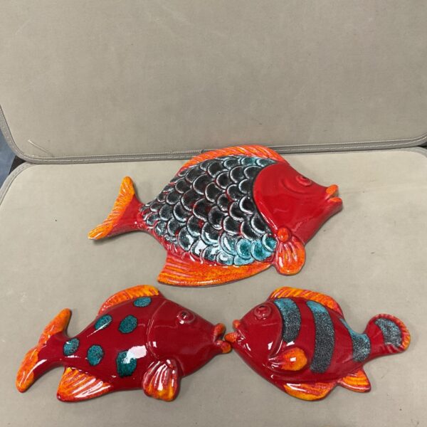 Set of three vintage Italian terracotta tropical fish wall plaques.