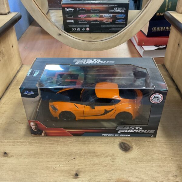 Boxed orange Jada Fast & Furious Toyota GR Supra diecast model in window box