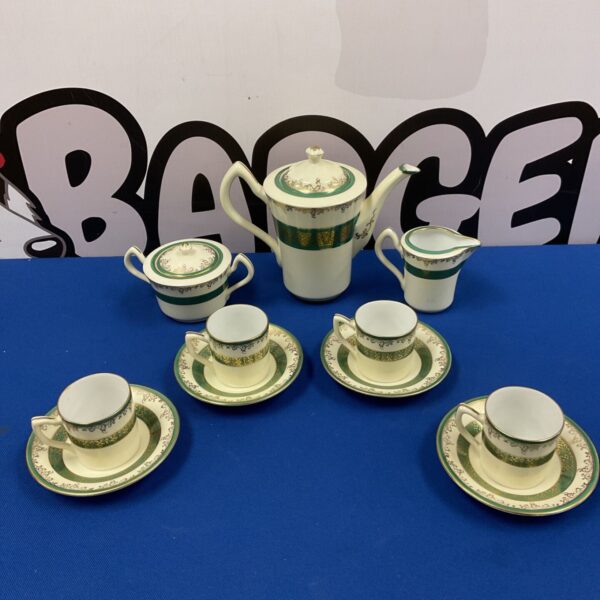 Vintage Japanese Meito china coffee set with floral design.