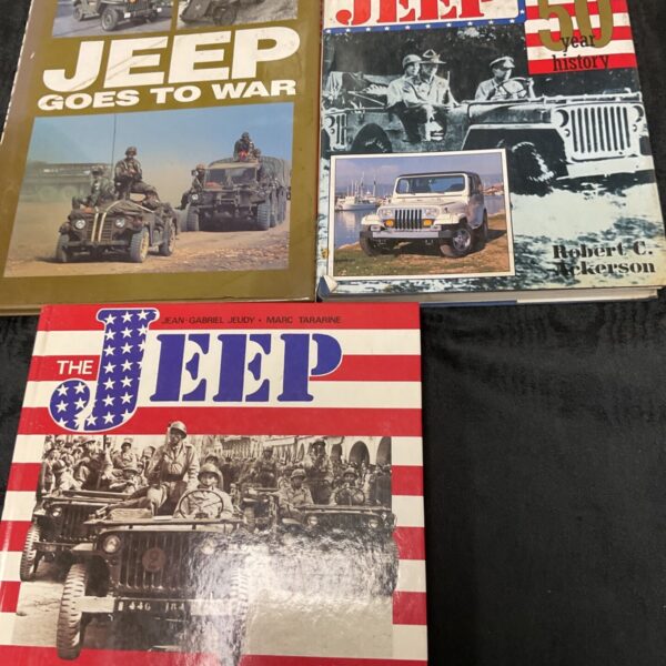 Vintage Jeep books collection including "Jeep Goes to War".