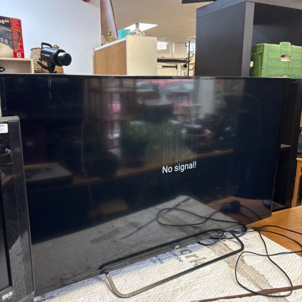 JVC 50 inch smart TV needing repair for parts or restoration.