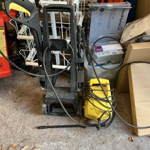 Karcher Powerwasher pressure washer with yellow body, black frame and hose