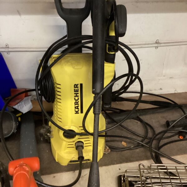 Yellow Karcher powerwasher with black handle, trigger lance and hoses