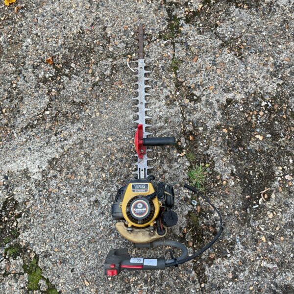 Used Kawasaki TF22 hedge trimmer for garden landscaping.