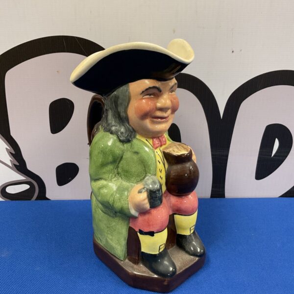 Vintage Kelsboro character jug depicting a gentleman in green.