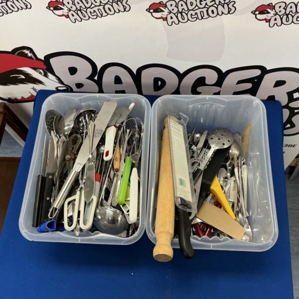 Assorted kitchen utensils in a plastic container, a kitchen utensil lot.