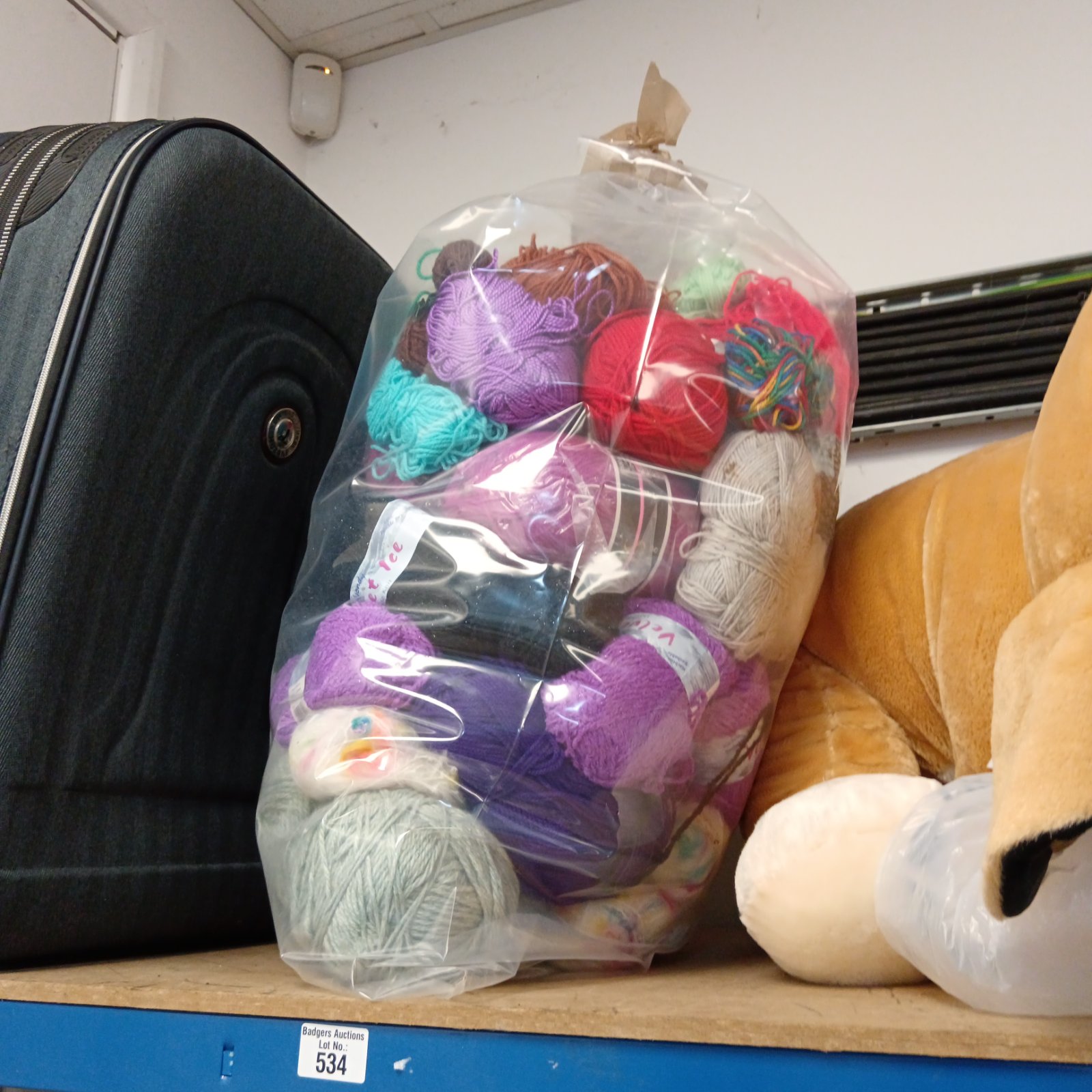 Large lot of colourful knitting wool for various craft projects.