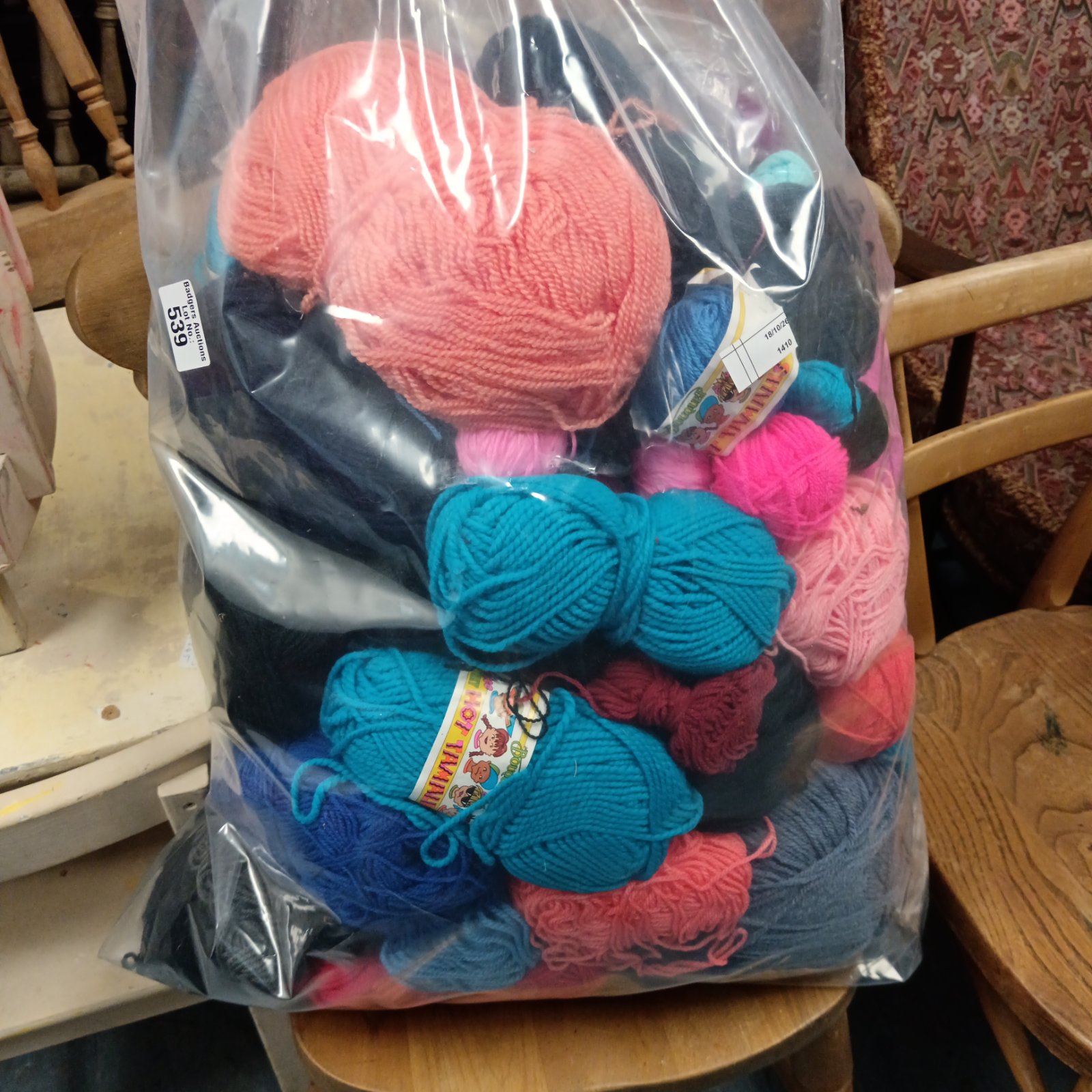 Large lot of colourful knitting wool for various craft projects.