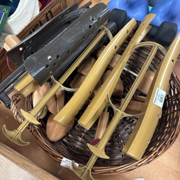 Basket of ladies shoe and boot stretchers with metal and wooden shoe trees