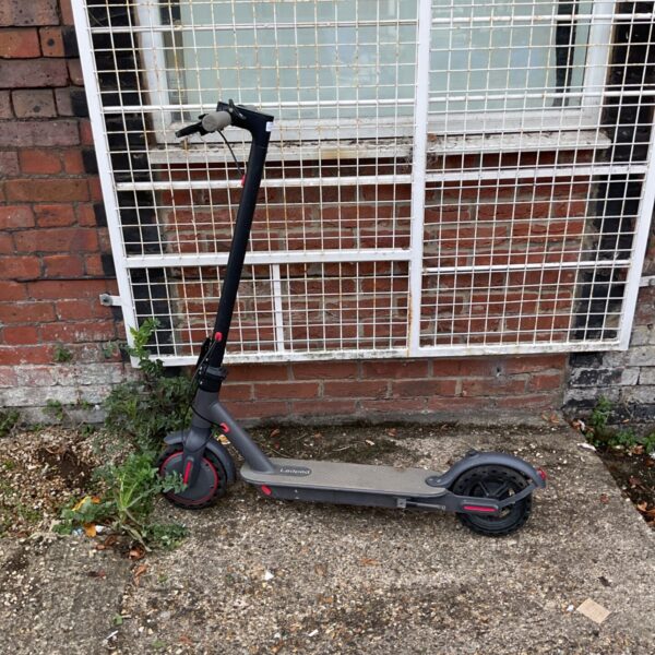 Black and red Ladped electric scooter for repair or parts.