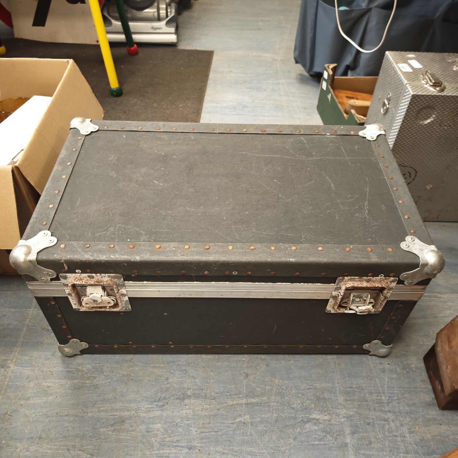 Large aluminium flight case with secure clasps, ideal for equipment storage.