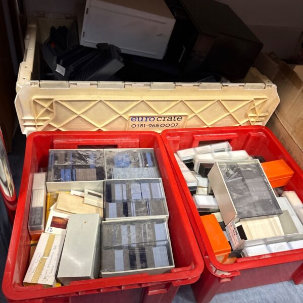 Large job lot of projector slides in mounts within red plastic crates