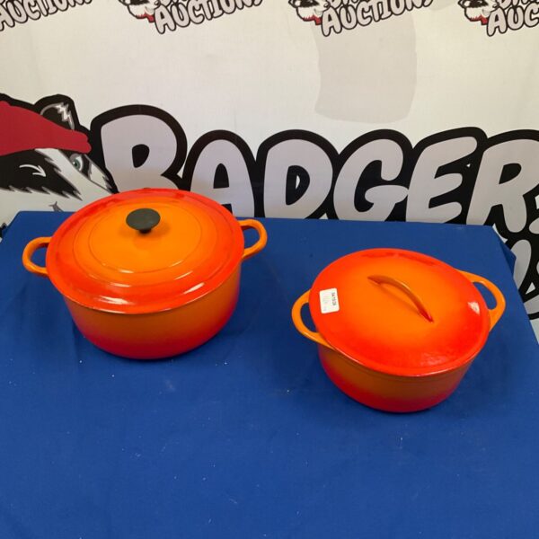 Vibrant orange Le Creuset casserole dish, cast iron enamel cookware.