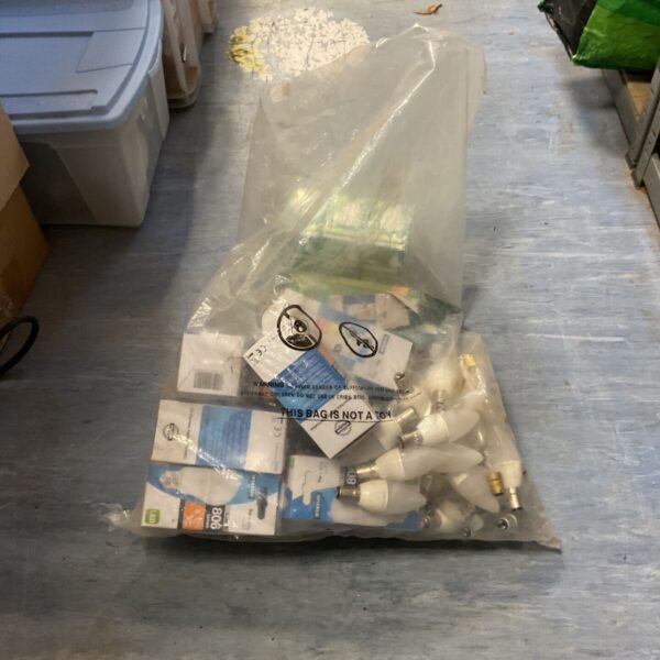 Clear bag of LED candle light bulbs with bayonet caps and boxed bulbs