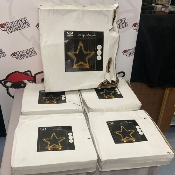 Box of five LED foil star Christmas decorations for festive lighting.