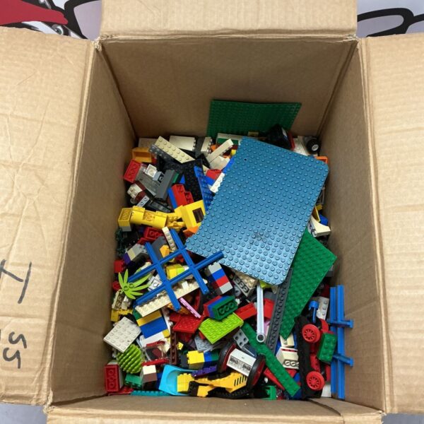 Assorted Lego bricks in a box, colourful building blocks.