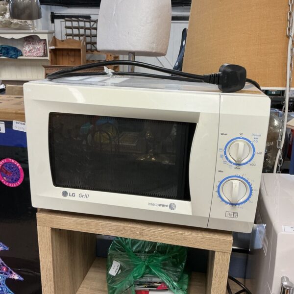White LG intellowave grill microwave, model MS-2391W, kitchen appliance.
