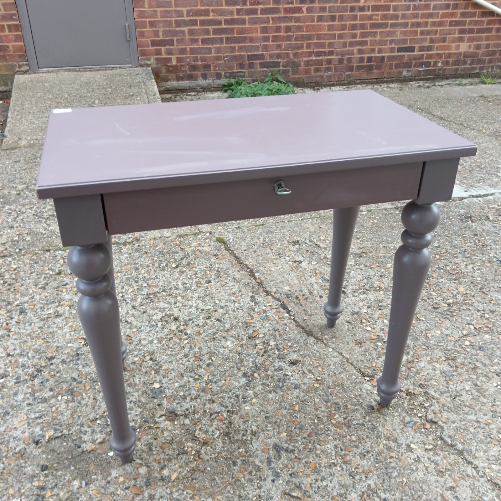 Lilac hall table with drawer and turned legs.