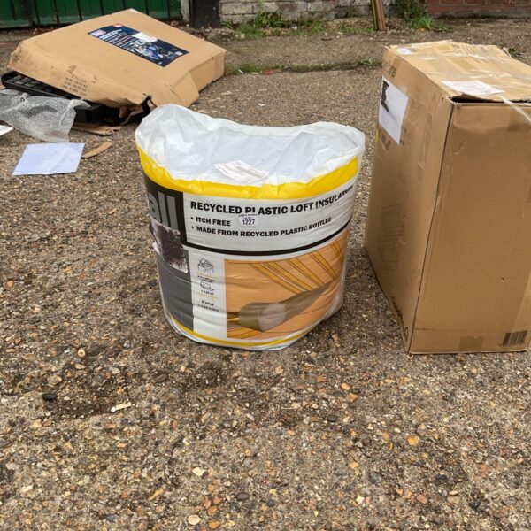 Roll of recycled plastic loft insulation for thermal efficiency.